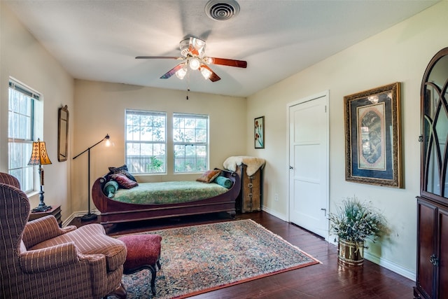 bedroom featuring dark hardwood / wood-style floors and ceiling fan