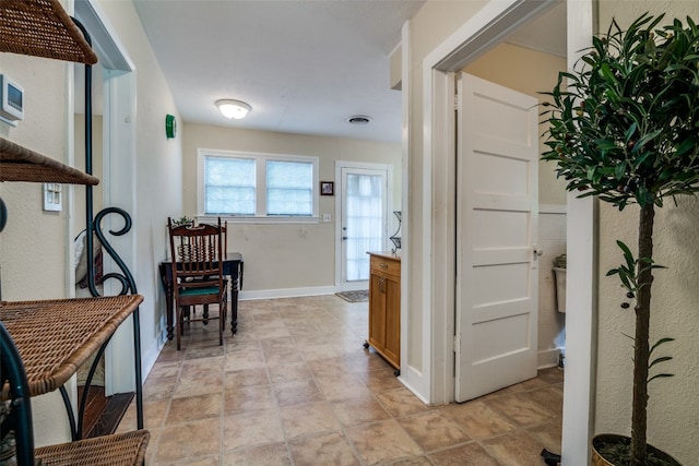 hallway with light tile floors