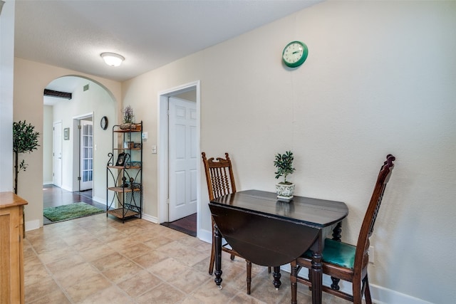 dining space featuring tile floors