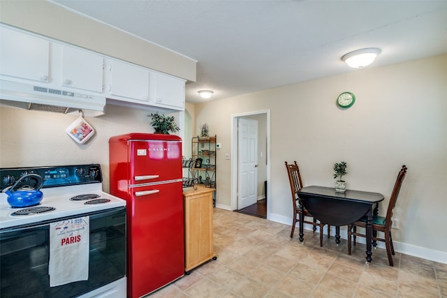 kitchen with white electric range oven, white cabinetry, high quality fridge, and light tile floors