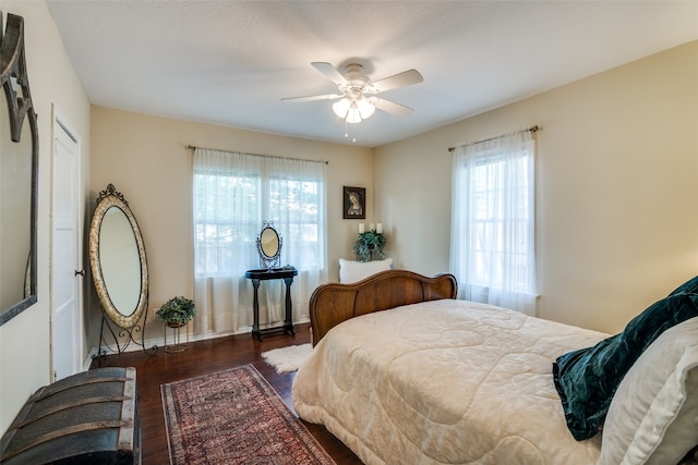 bedroom featuring ceiling fan and dark hardwood / wood-style flooring