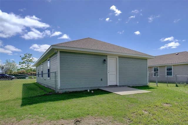 rear view of house with a lawn