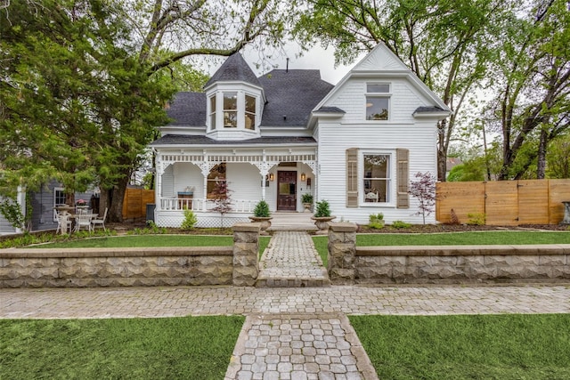 victorian-style house featuring a porch