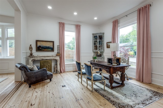 interior space featuring ornamental molding and light hardwood / wood-style flooring