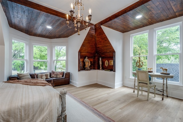 bedroom with wood ceiling, light hardwood / wood-style flooring, and an inviting chandelier