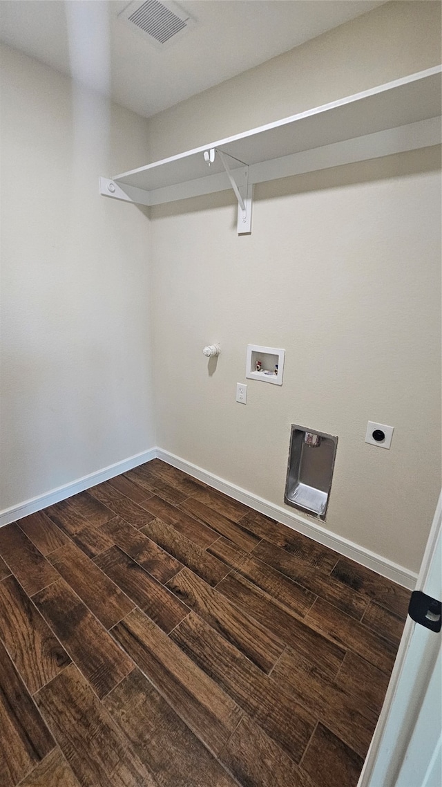 clothes washing area featuring hookup for a washing machine, dark hardwood / wood-style floors, and electric dryer hookup