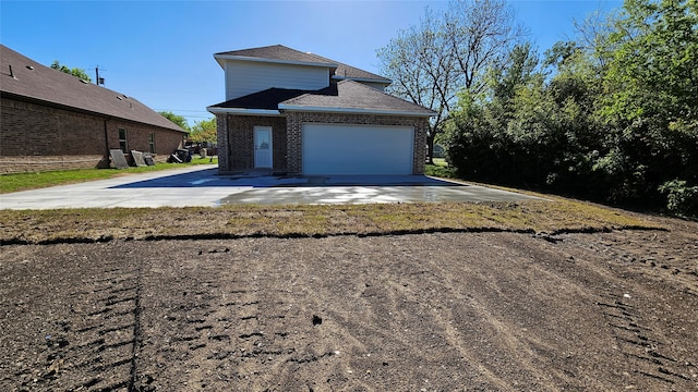 view of side of property featuring a garage