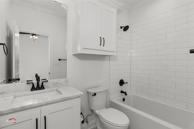 full bathroom featuring crown molding, toilet, vanity, and tiled shower / bath combo