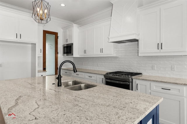 kitchen with white cabinetry, tasteful backsplash, appliances with stainless steel finishes, and sink