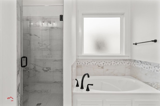 bathroom with shower with separate bathtub