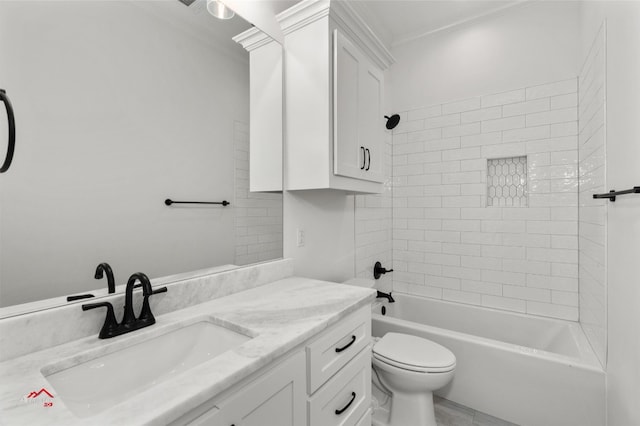 full bathroom with tile floors, tiled shower / bath, toilet, vanity with extensive cabinet space, and crown molding