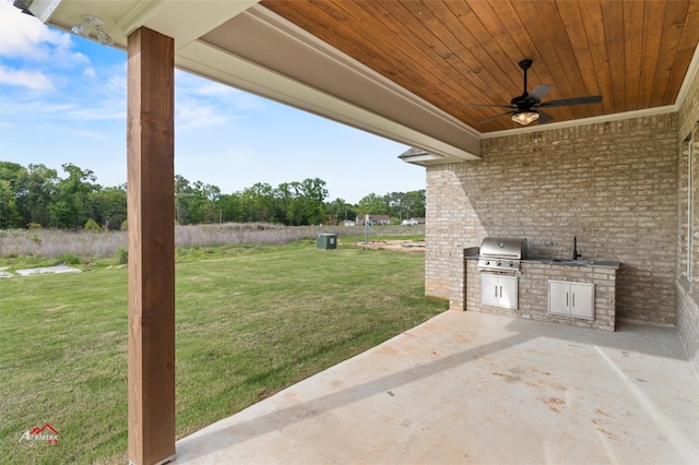 view of patio featuring area for grilling, an outdoor kitchen, ceiling fan, and sink