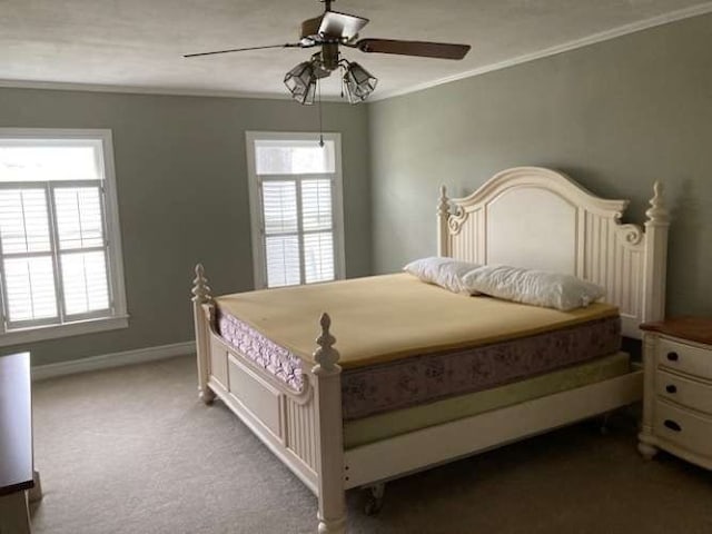 bedroom with light carpet, multiple windows, ornamental molding, and ceiling fan