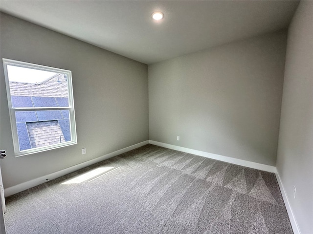 empty room featuring light colored carpet