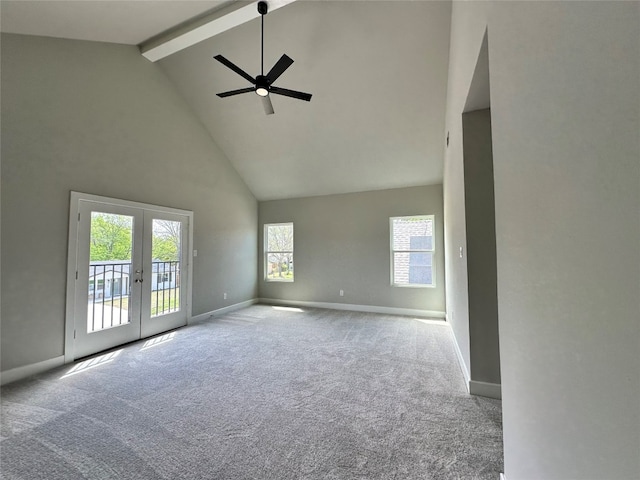 unfurnished room featuring french doors, ceiling fan, light carpet, high vaulted ceiling, and beam ceiling