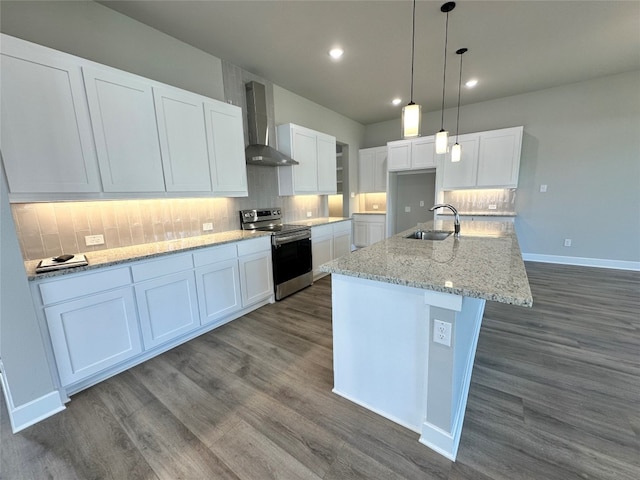 kitchen with white cabinets, stainless steel range with electric stovetop, dark wood-type flooring, and wall chimney range hood