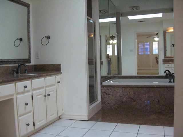 bathroom with vanity, tile floors, ceiling fan, and independent shower and bath