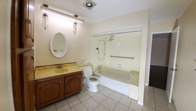 full bathroom with  shower combination, toilet, tile floors, and vanity with extensive cabinet space