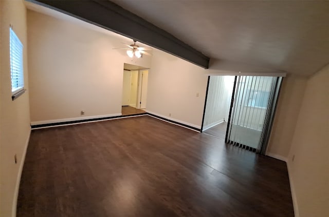 empty room with dark hardwood / wood-style flooring, ceiling fan, and vaulted ceiling with beams