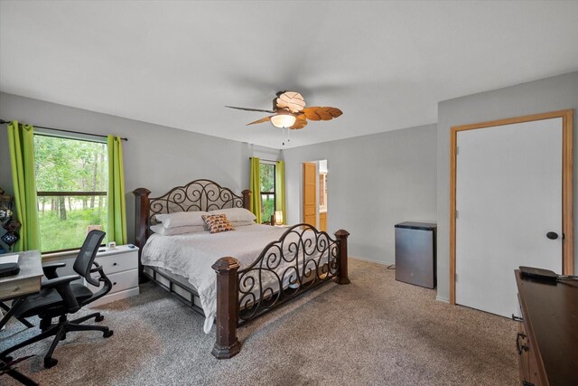 bedroom featuring carpet flooring, ceiling fan, and access to outside