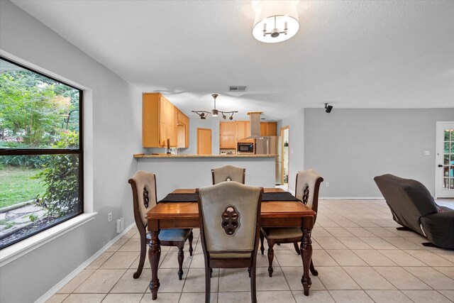 stairway featuring light tile floors