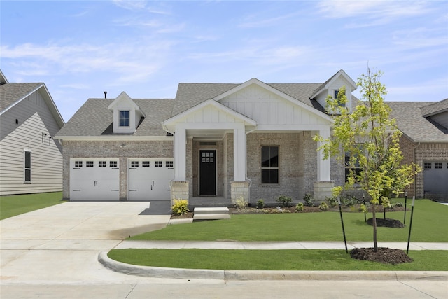 craftsman-style home featuring a front lawn and a garage