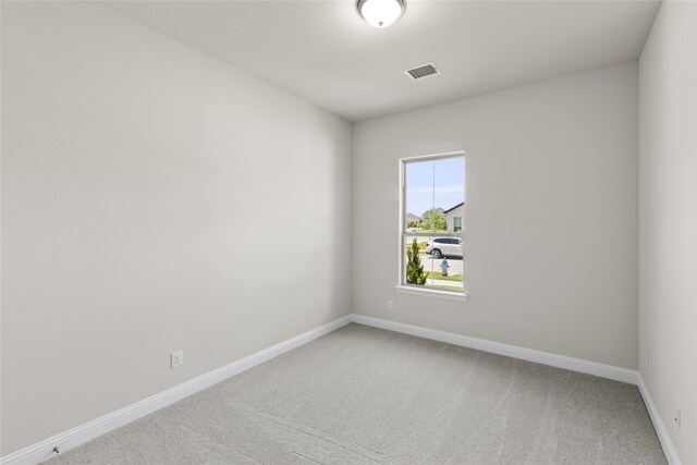 empty room featuring carpet flooring