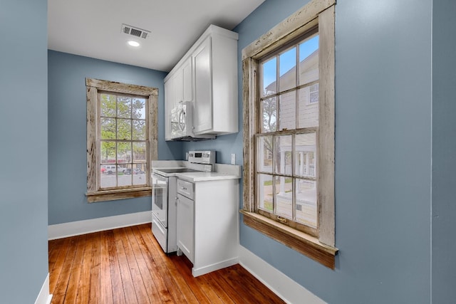 laundry area featuring wood-type flooring