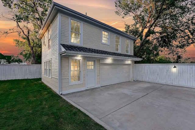 exterior space with a lawn and a garage