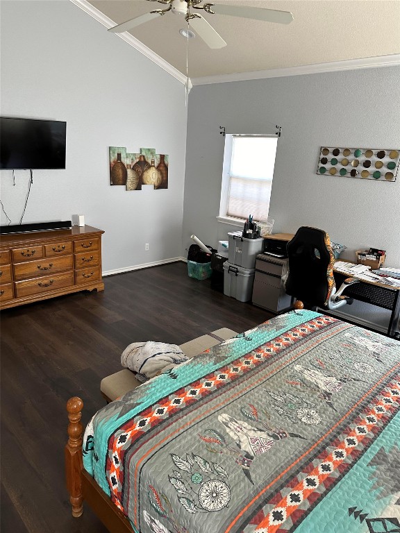 bedroom featuring crown molding, ceiling fan, and dark hardwood / wood-style flooring