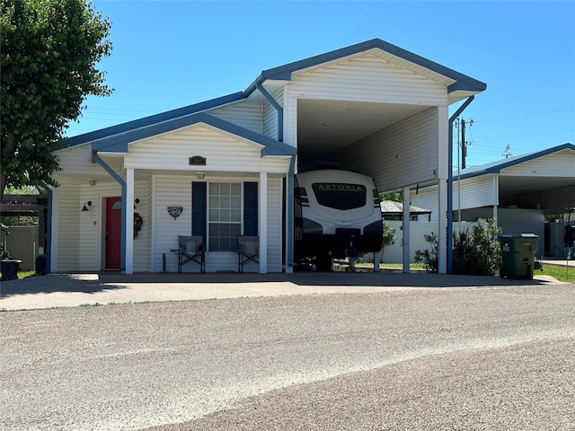 view of front facade with a carport