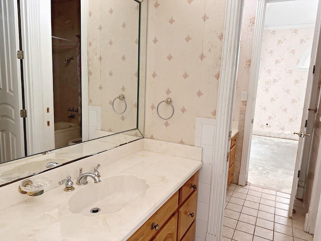 full bathroom featuring tile floors, toilet, vanity, and shower / tub combination