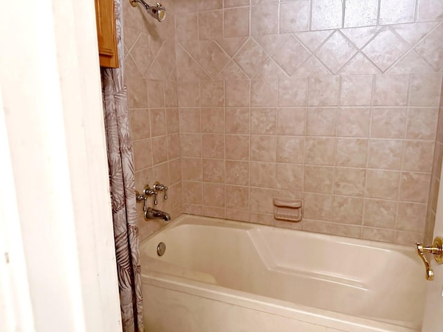 bathroom with shower / tub combo with curtain