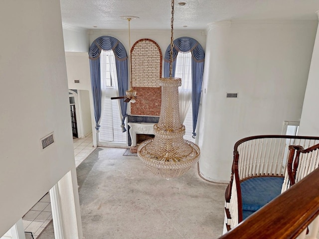 dining room featuring a textured ceiling and ornamental molding