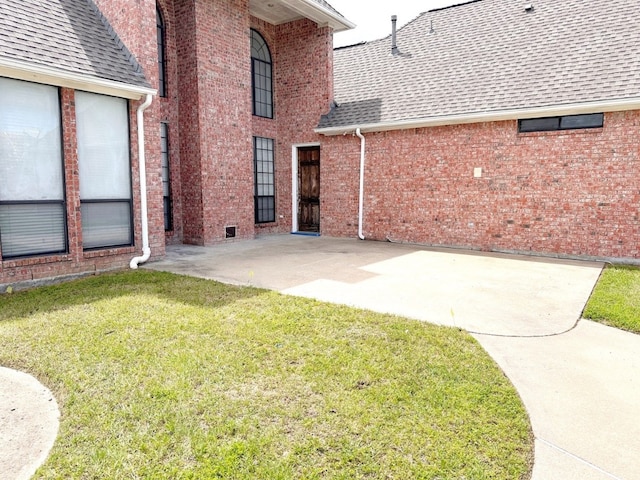 exterior space with a patio and a yard