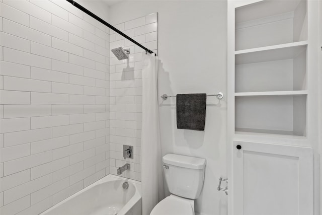 bathroom featuring shower / bath combo and toilet