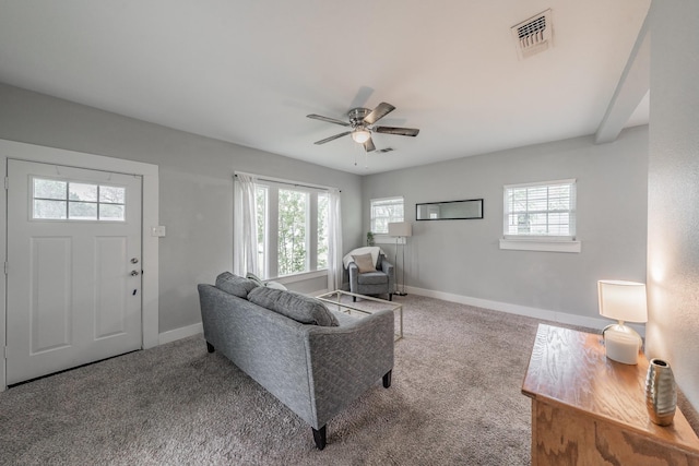 carpeted living room featuring ceiling fan