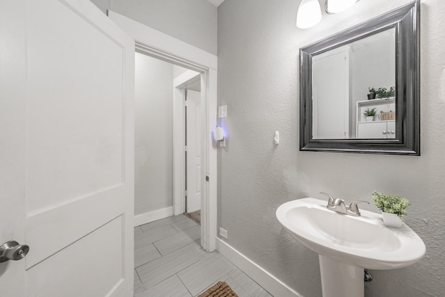 bathroom with tile patterned floors and sink