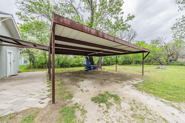 view of car parking featuring a yard