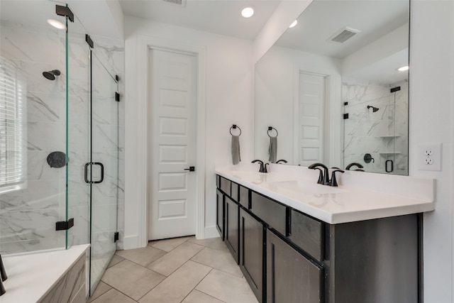 bathroom with oversized vanity, tile floors, and walk in shower