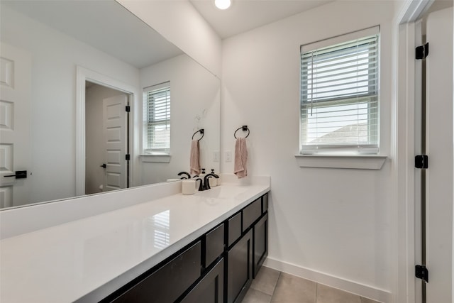 bathroom featuring tile floors and large vanity