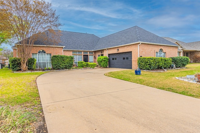 view of front facade with a garage and a front yard