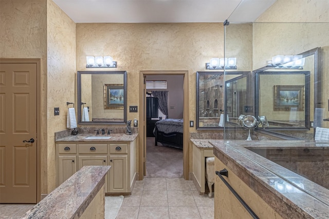 bathroom featuring vanity, a chandelier, and tile patterned flooring