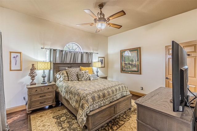 bedroom with ceiling fan and hardwood / wood-style flooring