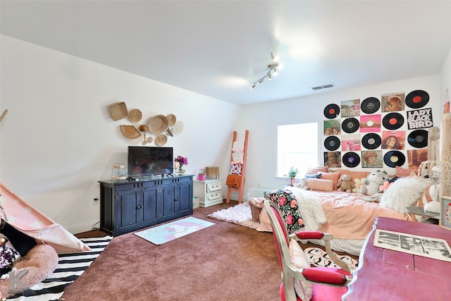 living room featuring carpet and track lighting