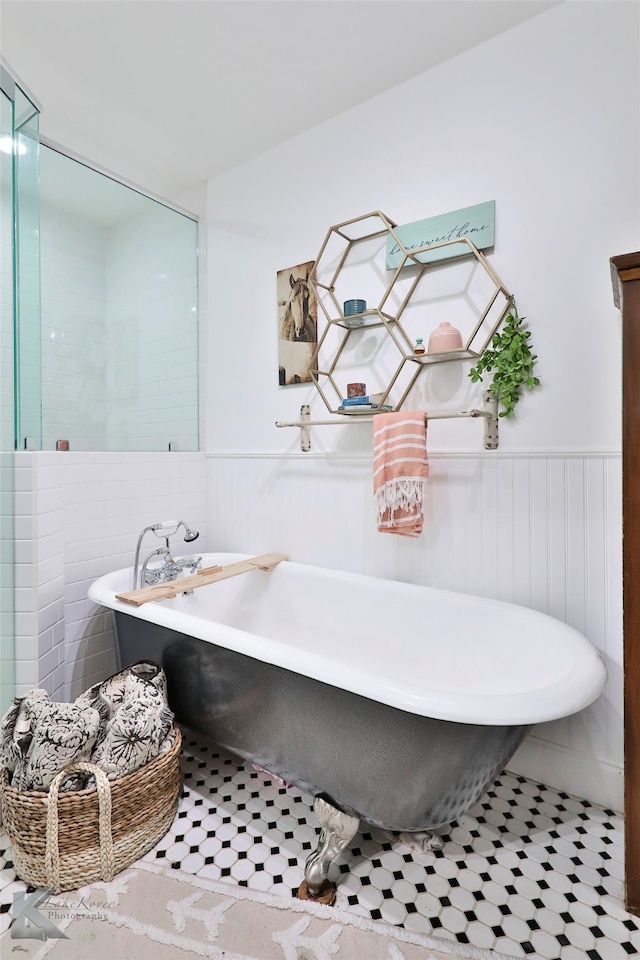 bathroom featuring a tub and tile flooring