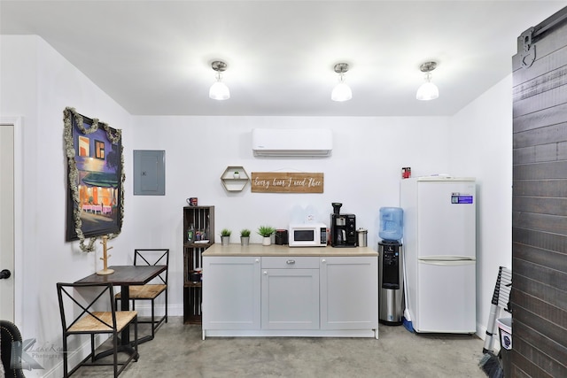 kitchen with an AC wall unit and white appliances