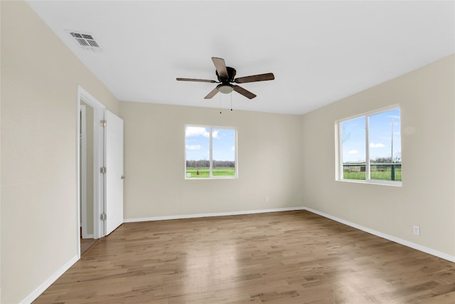 spare room with ceiling fan and light hardwood / wood-style flooring