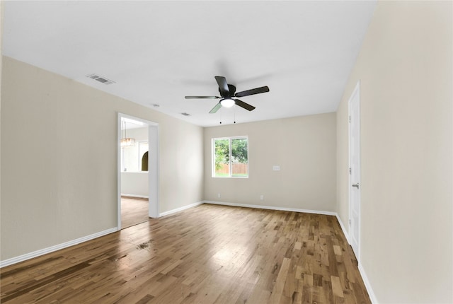 spare room featuring ceiling fan and light wood-type flooring