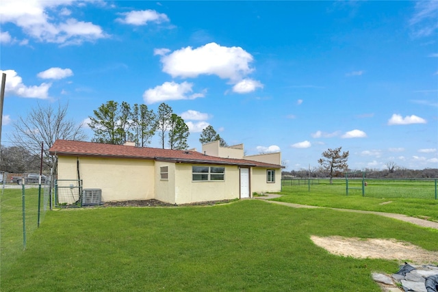 rear view of house with a yard